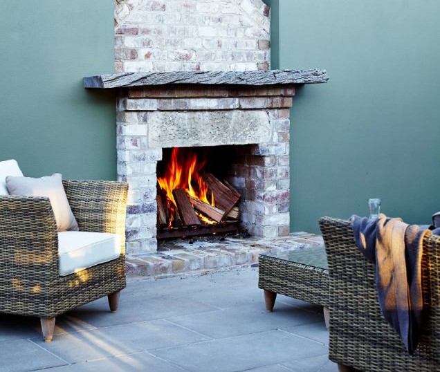 Adding a brazier or pizza oven to your outdoor space is perfect for enjoying winter evenings with friends. Image: Antscapes via Houzz