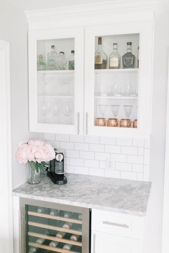 Glam it up with cabinetry, shelving and a touch of marble. Girls night in, anyone? (Source: stylemepretty)