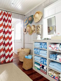 A simple dividing curtain, wall hooks and shelving create the ultimate poolside change room. (source: pinterest)