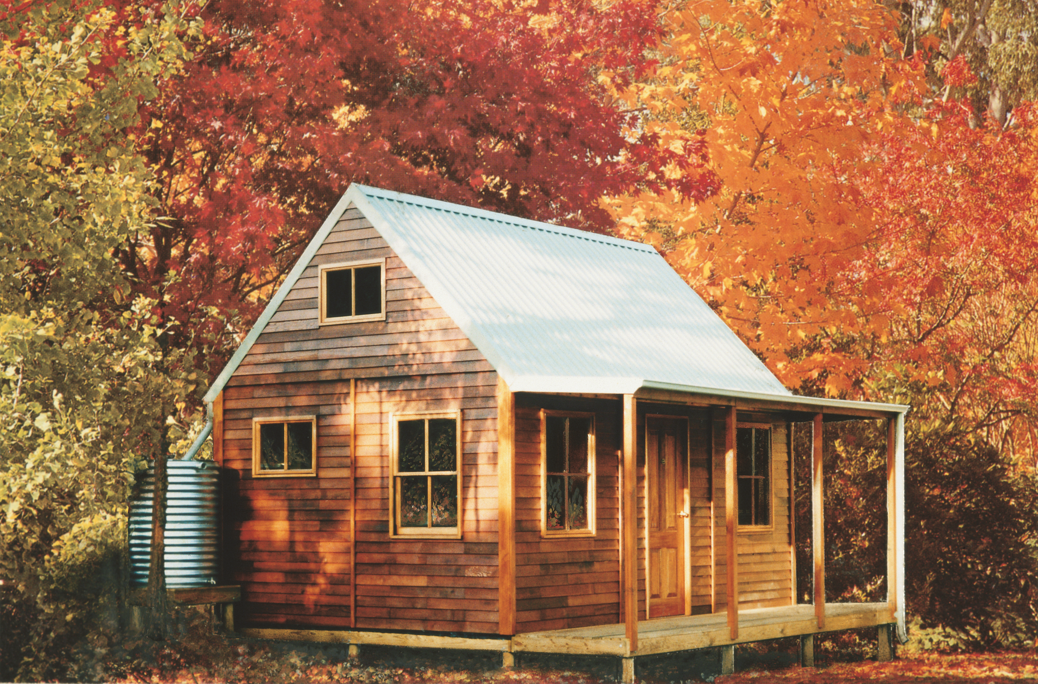 Cabin with autumn trees behind