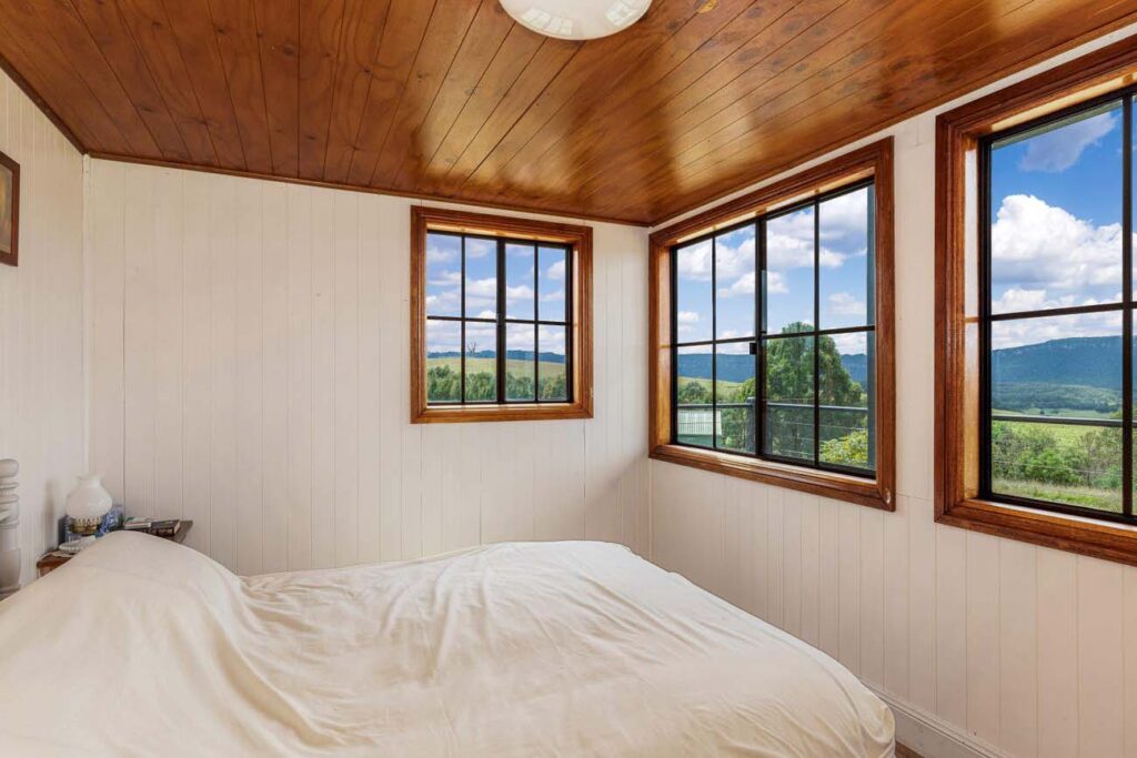 Country cottage bedroom with picture windows